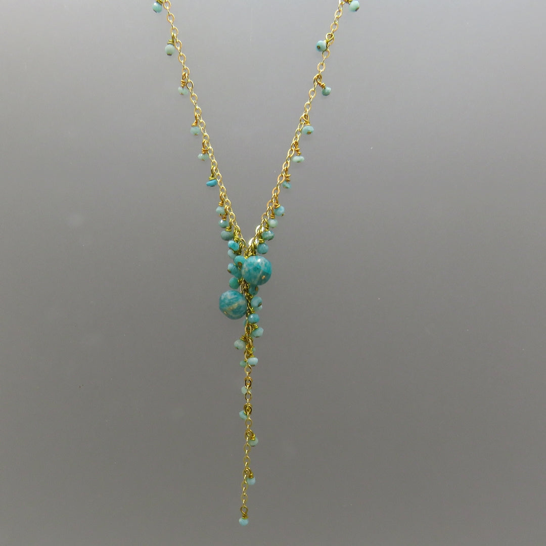 small turquoise color amazonite dangle from gold chain with an amazonite beads focus on Y necklace