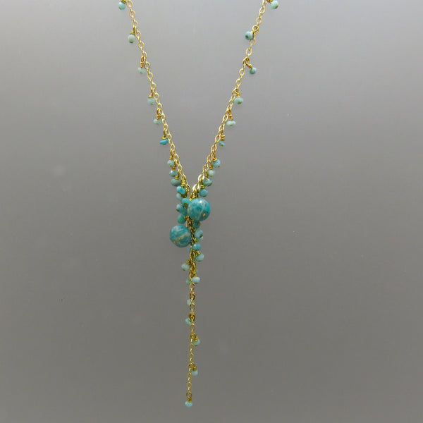 small turquoise color amazonite dangle from gold chain with an amazonite beads focus on Y necklace