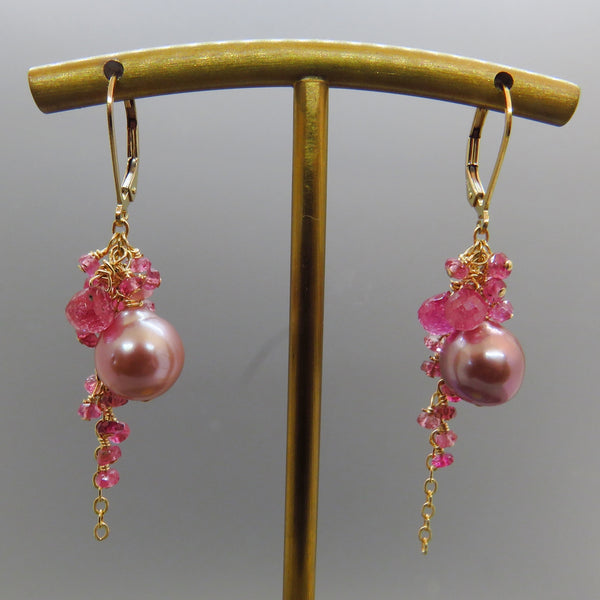 lavender pink pearls are surrounded by pink sapphires , gold leverbacks