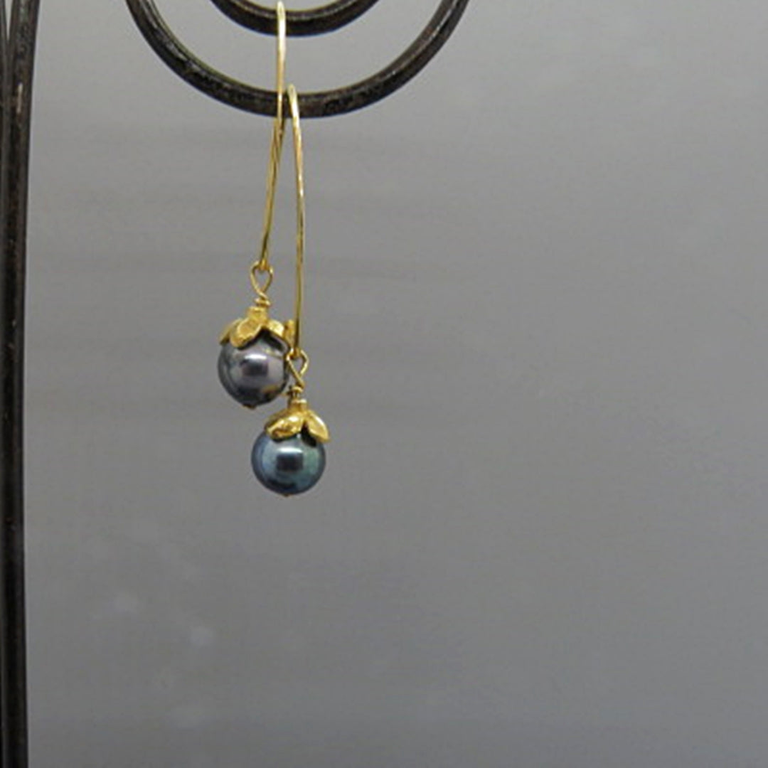 blue akoya pearls on long curved gold ear wire, small flower cap, handcrafted