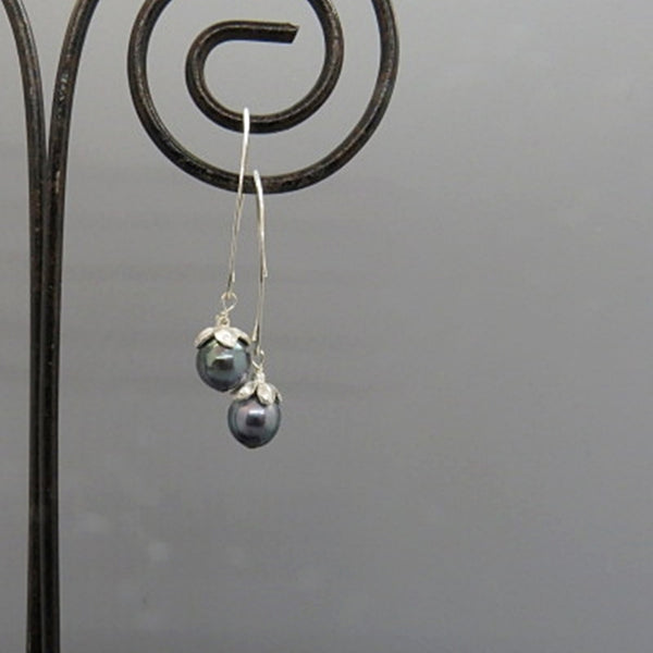 blue akoya pearls on long curved silver ear wire, small flower cap, handcrafted