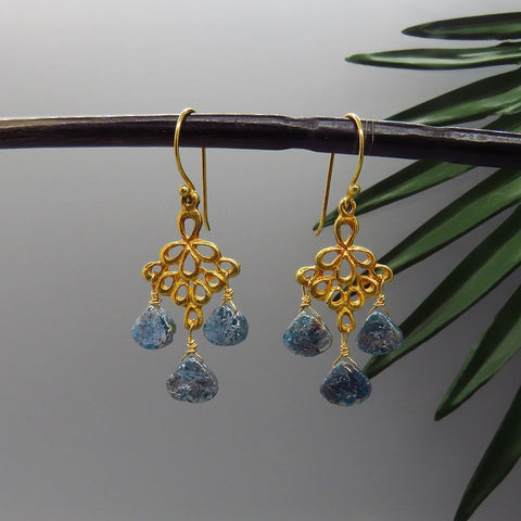 teal mystic agate gems hang from artisan gold chandeliers, handcrafted