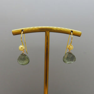 moss aquamarine gemstones dangle from  a swirl design vermeil ear wire.