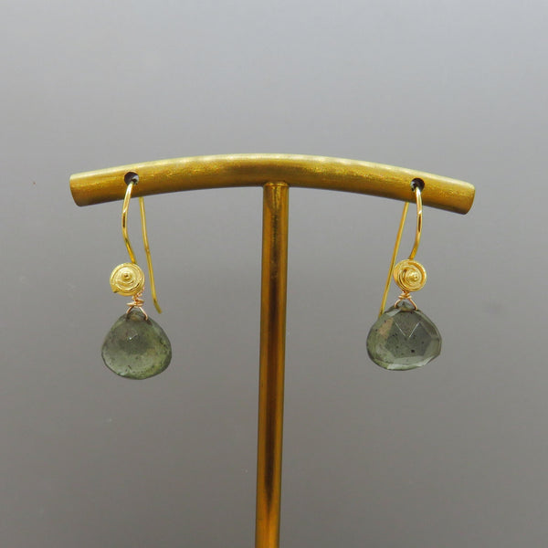 moss aquamarine gemstones dangle from  a swirl design vermeil ear wire.