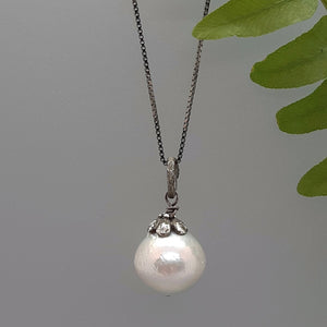 pale grey big pearl pendant, black rhodium chain, flower cap, handcrafted