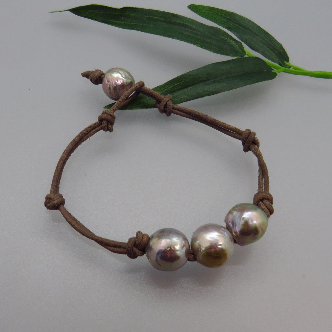 gray freshwater Edison pearls knotted on light brown leather cord for bracelet