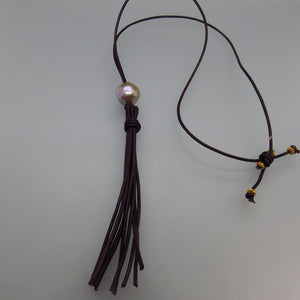 gray Edison pearl with brown leather cord and 4 inch leather tassel