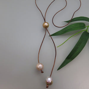 pale large peach pearl and brown leather lariat necklace