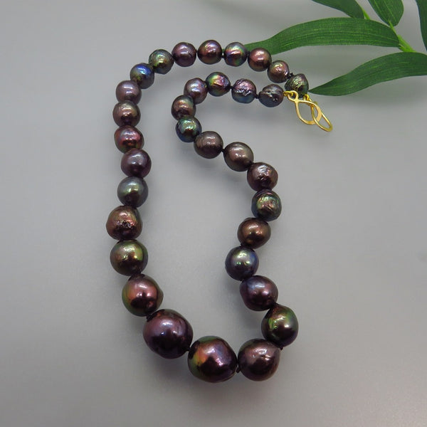 full strand black pearl, teal, eggplant bronze tones, hand knotted silk cord, gold hook clasp