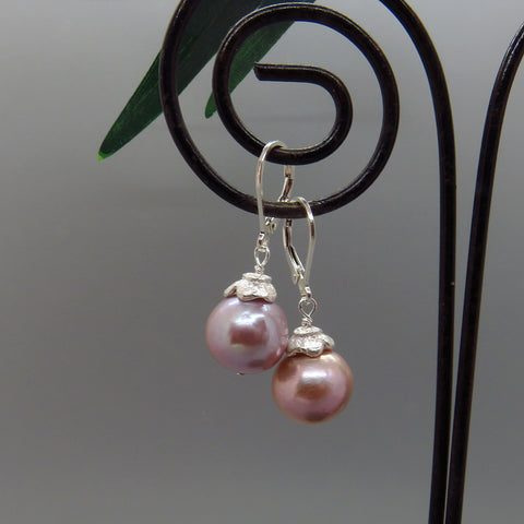 glowing pink pearls with silver flower cap, lever back ear wires