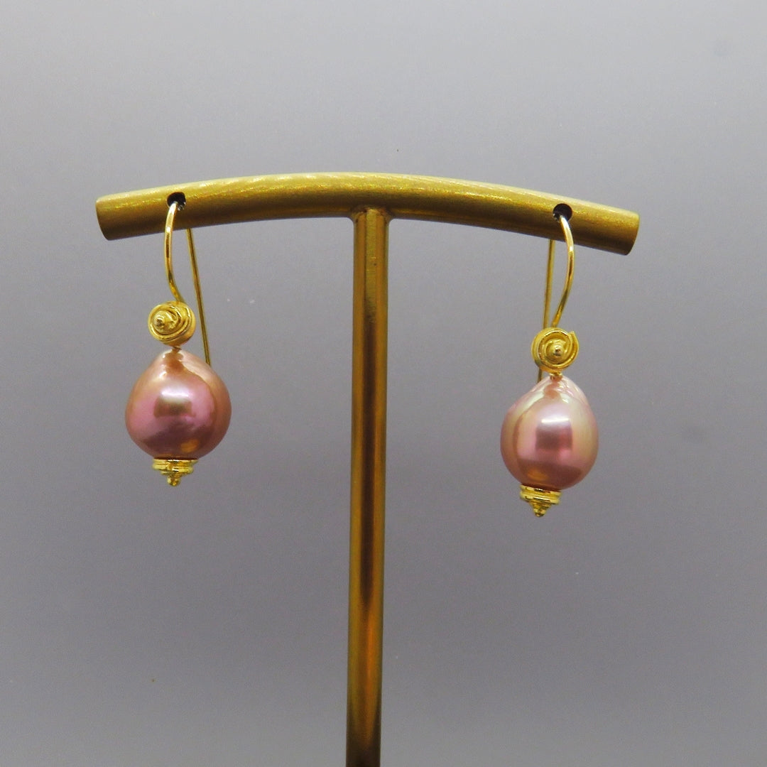 pink baroque pearl earrings with swirl design gold ear wires