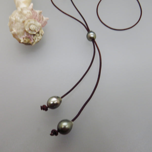 black leather lariat with one drop shape Tahiti pearl slides up and down with two drop Tahiti pearls