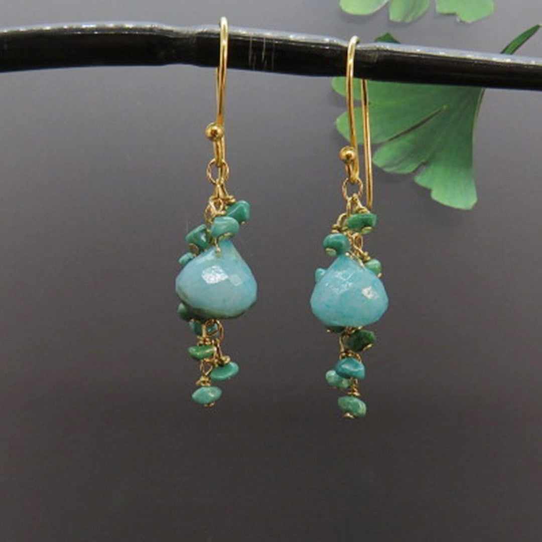 turquoise and chrysoprase gemstones dangle on gold chain