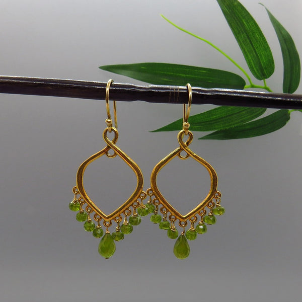 vivid green faceted gems dangle on gold chandelier, french earwires