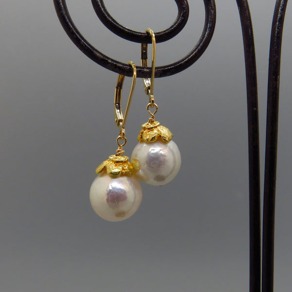 glowing white Edison pearls with gold vermeil caps and gold lever back ear wires.