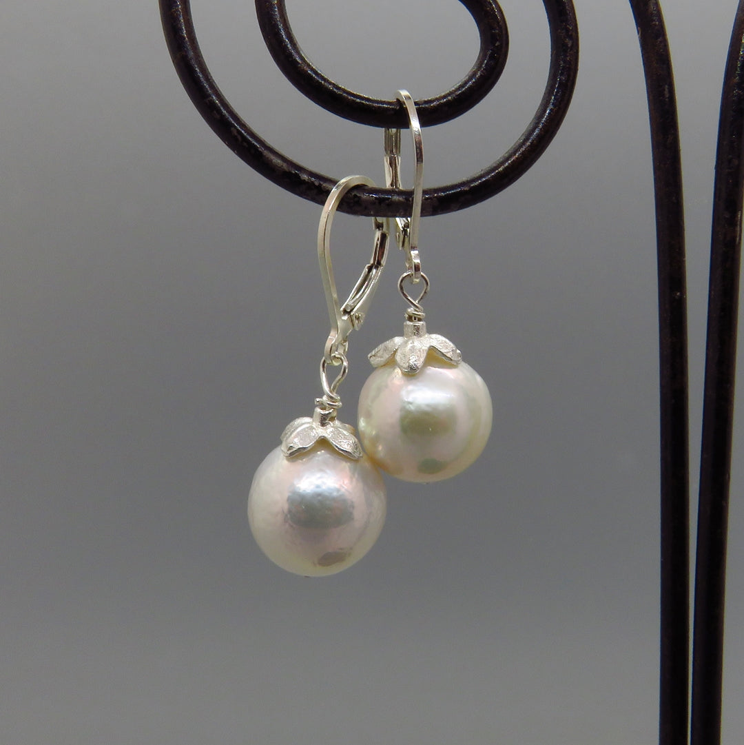 glowing white Edison pearl earrings with silver cap and lever back ear wires