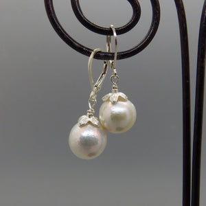 glowing white Edison pearl earrings with silver cap and lever back ear wires